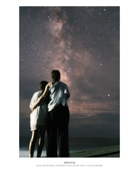 Two people under the Milky Way, in a white 4:5 frame